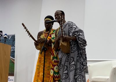 Two musicians performing with traditional instruments.