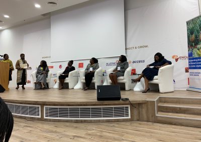 Panel discussion with six women on stage.