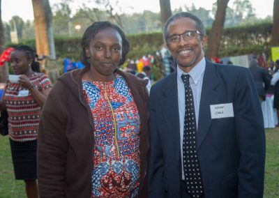 Two people posing at an outdoor event.